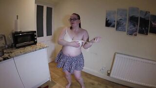 undresses in miniskirt