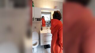 Trying on raincoats in rubber boots - large boobs