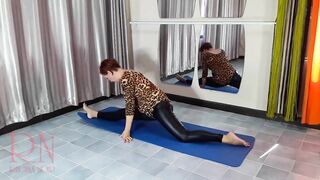 Regina Noir. Yoga in hawt leotards and latex leggings is doing yoga in the gym. two
