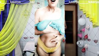 Glad Lukerya, as ordinary, is engaged in erotic cleaning in a transparent mesh on large hanging melons in yellow pants