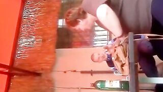 Older drunk woman showing bazookas .