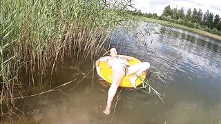 Playing with a Water Donut Stripped in the Lake