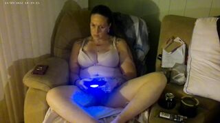 Breasty Lengthy Hair Brunette Hair In Brassiere and Pants Playing PlayStation