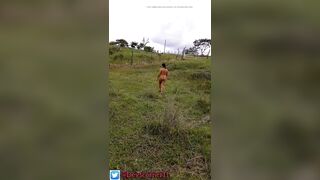 Devska walks totally stripped by the country whilst cars go by