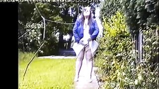 Savings Bank Manager Elizabeth Hogben pees in her back garden