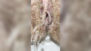 Large Unshaved Mamma's Twat Peeing and little Farting Closeup