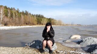 Cute mother i'd like to fuck smokes a cigarette and shows her nude vagina with a sex tool inside and her boobs outdoors. Amateur fetish in a public place.