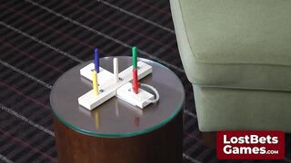 A lesbo pair's intensive disrobe game of 5-Point Quoits in the living room