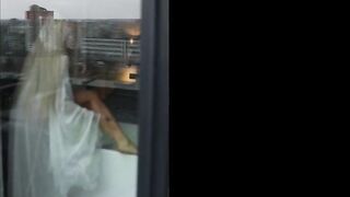 Seductive Golden-haired Undresses by the Bathtub