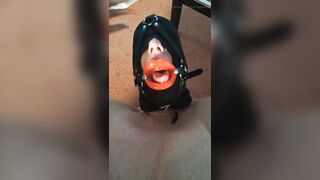 Aged woman in mask gets in throat.