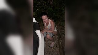 I'm peeing behind the car.