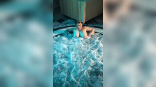 Older woman with big melons shows off her charms in the jacuzzi