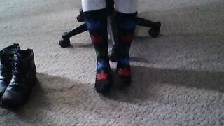 Becky putting on socks and Harley boots