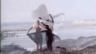 Golden-haired lesbos lovers lick every other on the sandy beach - Vintage clip- No audio,but music