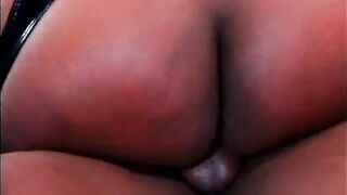 Ebony gal sucks jock and rides it wearing a garter strap