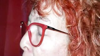 Redhead granny with glasses sucking a youthful bbc